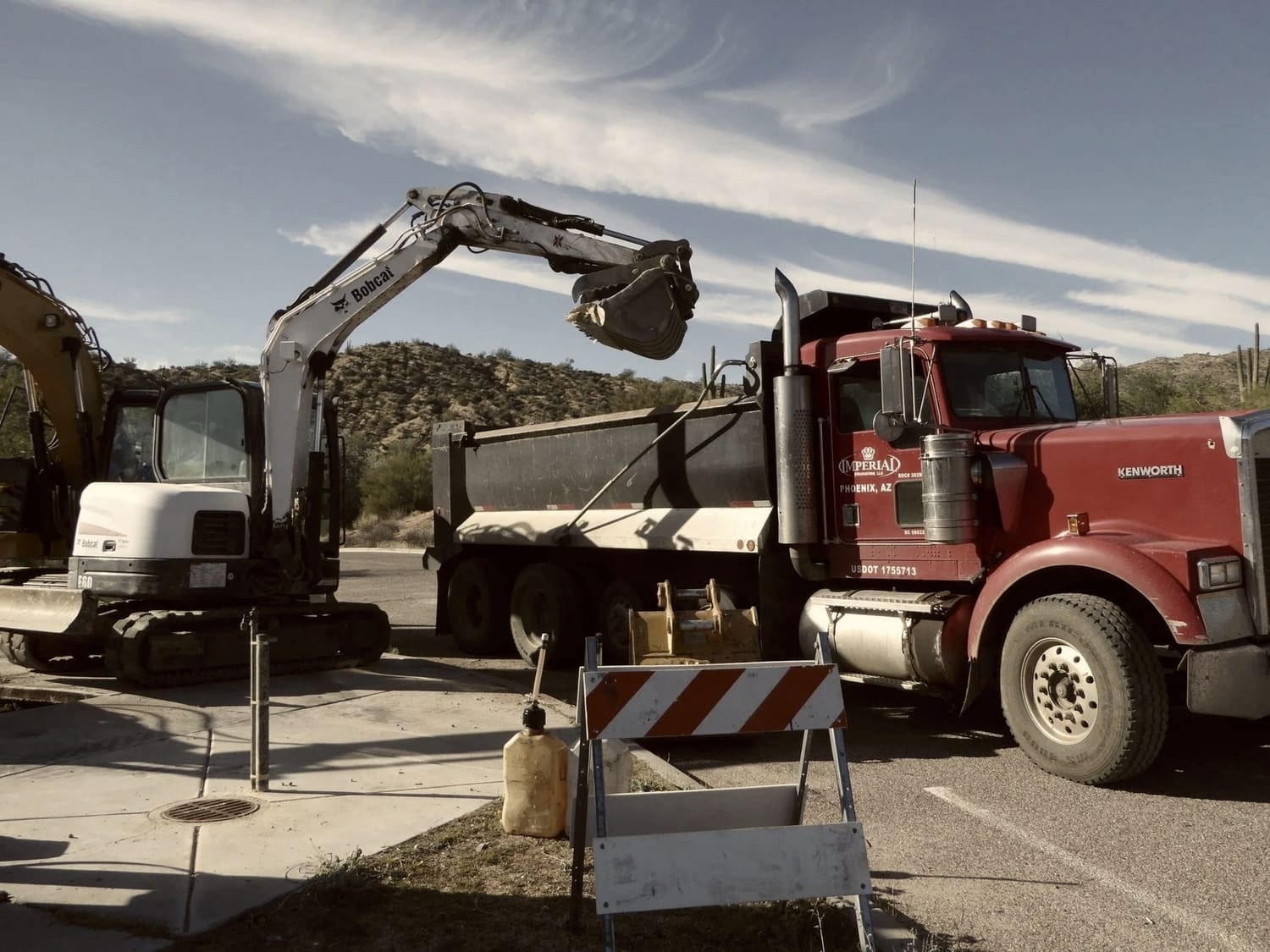 Loading a dump truck straight from the excavator bucket.